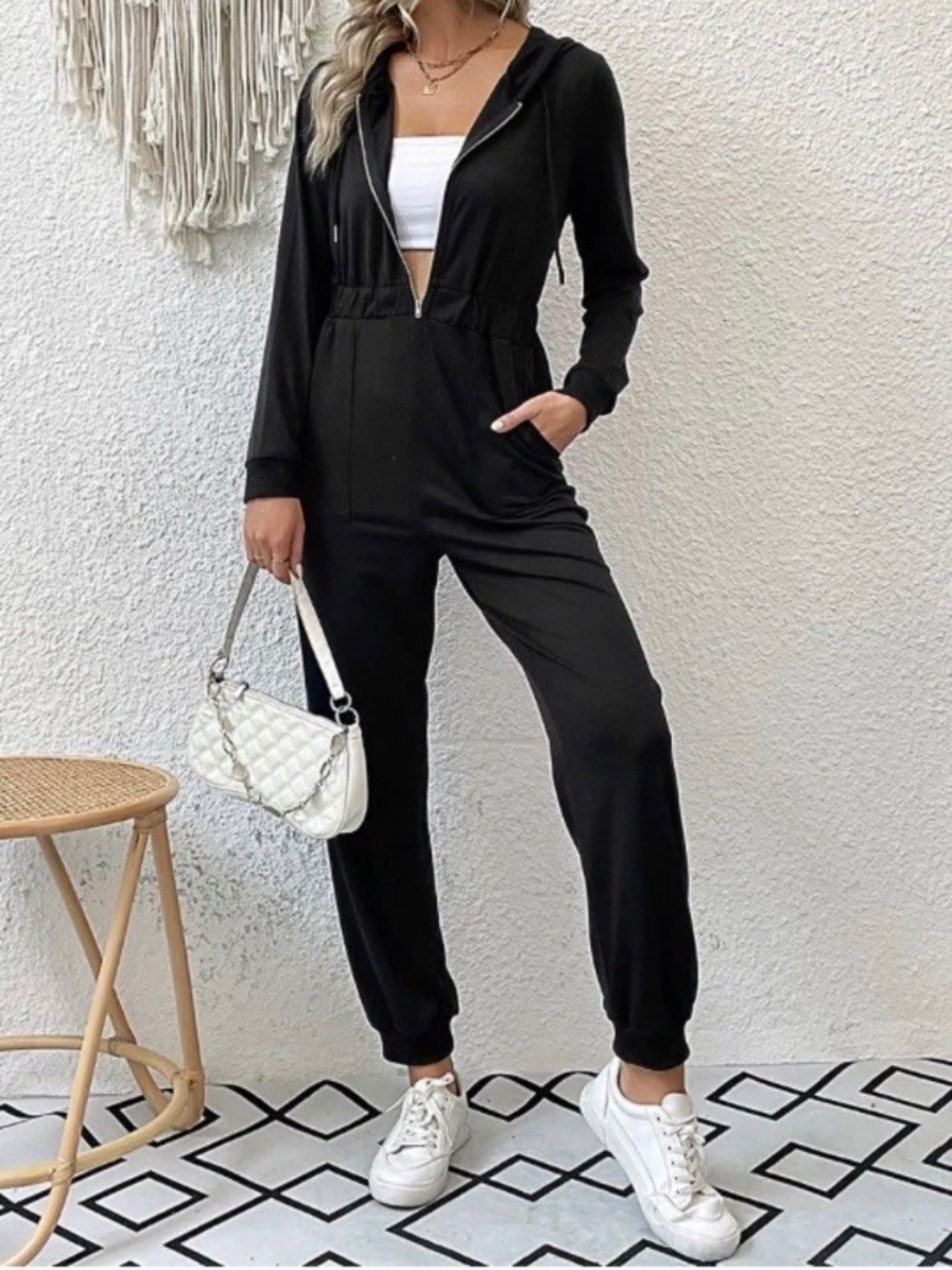 Women’s zip up black hooded one-piece jumpsuit